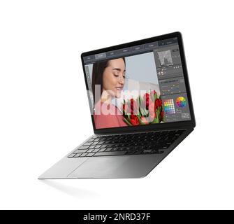 Laptop with photo editor application isolated on white Stock Photo