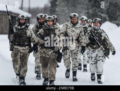 Finnish Army Soldiers assigned to the Jaeger Brigade, switch ranges holding their RK62M1 rifle during weapon familiarization training at Arctic Forge 2023 on Sodankylä Garrison, Finland, Feb 20, 2023. Exercise Arctic Forge 23 is a U.S. Army Europe and Africa led umbrella exercise that leverages the host nation exercises Defense Exercise North in Finland, and exercise Joint Viking in Norway, taking place Feb. 16 through March 17, 2023, focused on building capabilities and cooperation in support of the U.S. Army’s Arctic Strategy. (U.S. Army photo by Sgt. James Garvin) Stock Photo