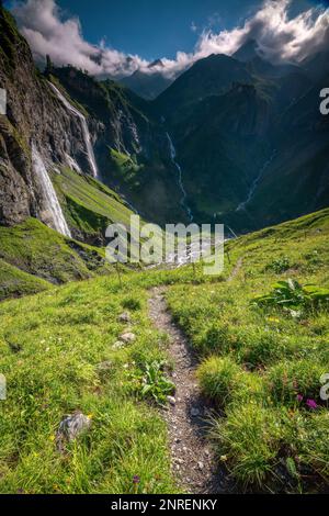 several large waterfalls falling down a steep cliff Stock Photo - Alamy