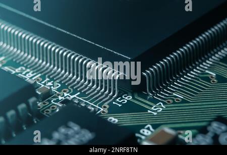 Macro photo of application specific integradet circuit in QFP package mounted on printed circuit board Stock Photo