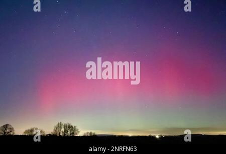 Handout photo dated 26/02/23 taken with permission from the twitter account of @RobDaviesEA of the northern lights over Cressage in Shropshire. Issue date: Monday February 27, 2023. Stock Photo