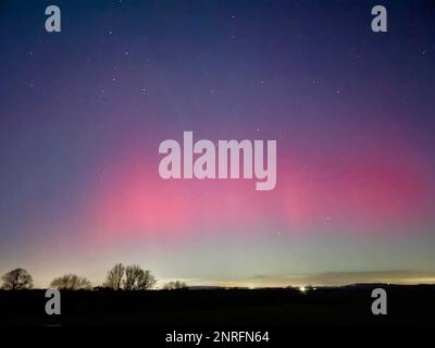 Handout photo dated 26/02/23 taken with permission from the twitter account of @RobDaviesEA of the northern lights over Cressage in Shropshire. Issue date: Monday February 27, 2023. Stock Photo