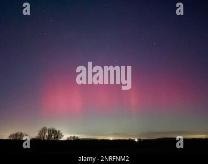 Handout photo dated 26/02/23 taken with permission from the twitter account of @RobDaviesEA of the northern lights over Cressage in Shropshire. Issue date: Monday February 27, 2023. Stock Photo