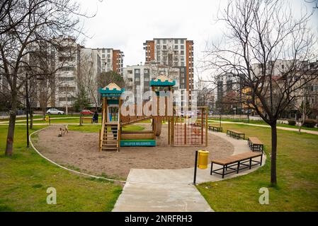 children's playground in the city , children's entertainment area with play sand floor , modern playground made of wood. High quality photo Stock Photo