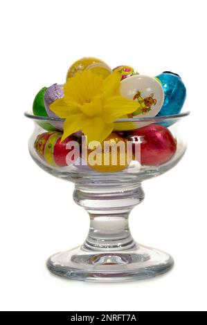 Easter eggs and flower in a big glass. Stock Photo