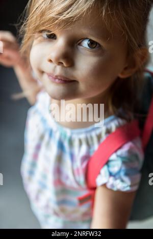 Close up of preschool aged girl standing outside Stock Photo