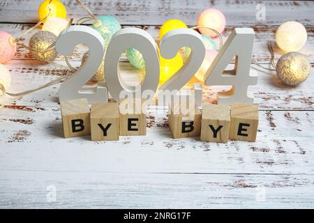 Goodbye 2024 alphabet letters with space copy on wooden background Stock Photo