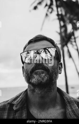 Portrait of a middle-aged man in mirrored sunglasses. reflection Stock Photo
