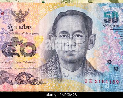 Macro detail with a 50 Thai Baht banknote. the baht is the official currency of Thailand Stock Photo