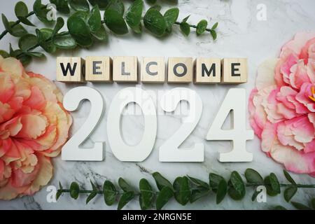 Welcome 2024 alphabet letters on marble background Stock Photo