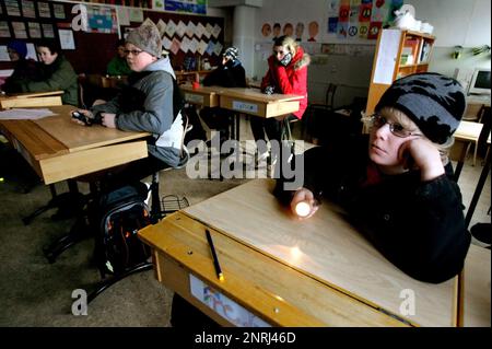 After the storm Per. Children in a dark classroom at Björsäters school, Sweden, during a power outage after the storm Stock Photo