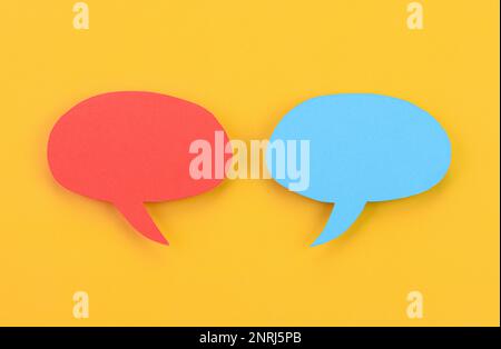 Speech bubbles arranged on a yellow background Stock Photo