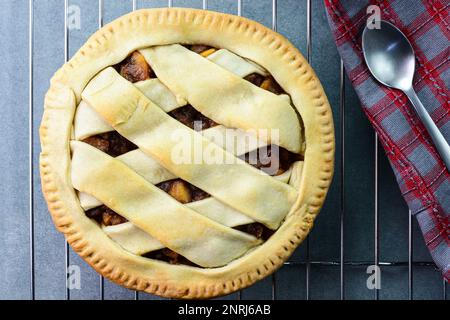 Freshly baked apple pie on an oven tray Stock Photo