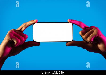 Cropped of black guy user holding smartphone, mockup Stock Photo