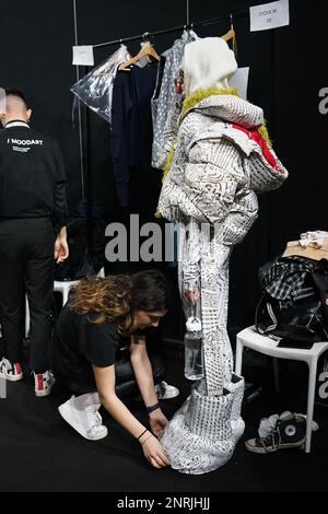 The backstage of Budapest Select at Milan Fashion Week 2023 is a frenetic and energetic place, where designers, models, make-up artists Stock Photo