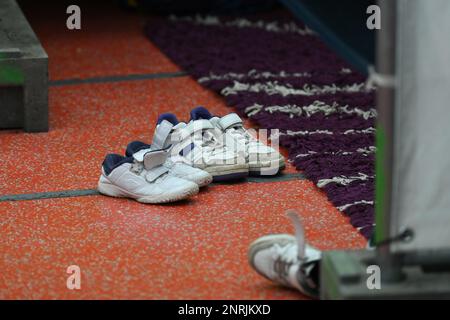 Bensheim, Germany. 10th Feb, 2023. Shoes of a refugee family are placed in a tent of the refugee shelter in front of a residential lot. Credit: Arne Dedert/dpa/Alamy Live News Stock Photo