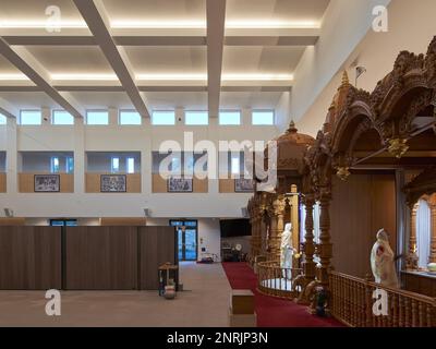 Main prayer hall. Shree Swaminarayan Mandir, Oldham, United Kingdom. Architect: LTS Architects   , 2022. Stock Photo