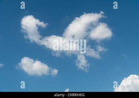 beautiful blue sky with a few patchy white clouds. Stock Photo