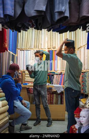 Kathmandu, Nepal, 04 23 2022: Trying on hats Stock Photo