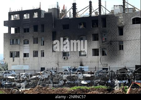 Hawara, Gaza. 27th Feb, 2023. A view of a building and cars burned by Israeli settlers in a revenge attack after two Israeli brothers were killed yesterday by a Palestinian gunman in Hawara, in the West Bank, on Monday, February 27, 2023. Photo by Debbie Hill/ Credit: UPI/Alamy Live News Stock Photo