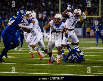 BOISE, ID - OCTOBER 21: Boise State Broncos cornerback Avery Williams (26)  leads his teammates onto the field with 'the hammer' during the regular  season game between the Wyoming Cowboys verses the