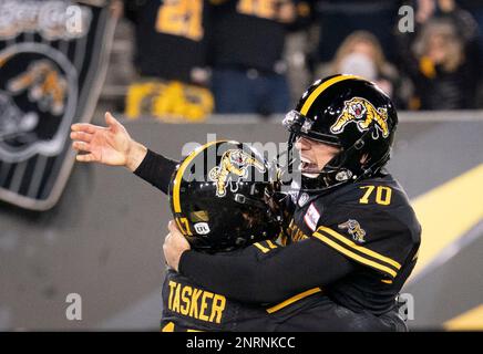 Hamilton Tiger-Cats kicker Lirim Hajrullahu (70) misses a field goal attempt as Luke Tasker holds during the second overtime a CFL game against B.C. Lions in Vancouver, on Saturday