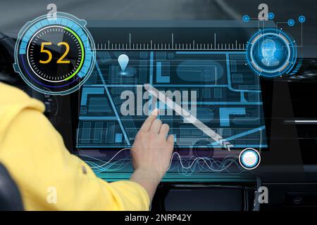 Woman using navigation system while driving car, closeup Stock Photo
