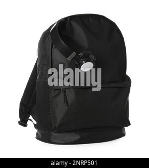 Black backpack with headphones on white background Stock Photo
