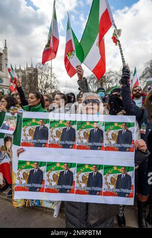 London, UK.  27 February 2023.  British Iranians take part in a protest in outside the Houses of Parliament demanding a regime change and rights for women in Iran.  The ongoing protest is in reaction to the death, on 16 September 2022 of Mahsa Amini, a 22-year-old Kurdish woman, who died in police custody in Tehran.  Allegedly, she had been detained by Iran’s morality police for wearing a hijab headscarf in an “improper” way. Credit: Stephen Chung / Alamy Live News Stock Photo