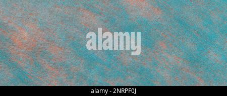 Structure of a light blue background with pink spots of felt fabric, closeup. Texture of woolen turquoise matt textile. Cloth backdrop. Stock Photo