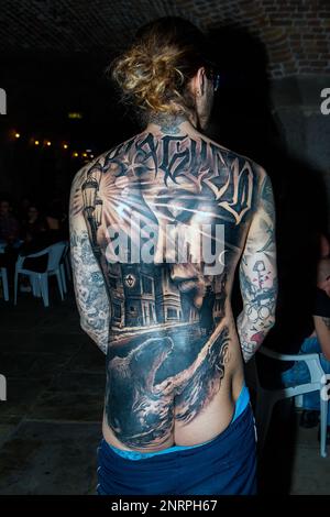 This is a composite tattoo completed simultaneously by 11 individual artist as featured on Youtube gaining a live stream of up to 11 million viewers. Collectors name unknown.  This image was captured at The 12th International London Tattoo Convention 2016, Tobacco Docks, Wapping, London. E2, UK. 25th September 2016 Stock Photo