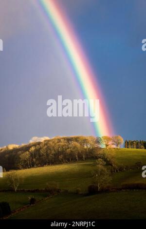 A spectacular rainbow over Stonewall Hill near Knighton on the Welsh borders Stock Photo