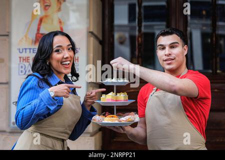 London, UK. 27th Feb, 2023. The cast pose outside the theatre. The Great British Bake Off Musical opens on the West End at Noël Coward Theatre for a twelve-week run from 25 February to 13 May 2023. Inspired by the TV show, this comedy musical follows amateur bakers as they seek to impress the judges and be crowned Star Baker. Credit: Imageplotter/Alamy Live News Stock Photo