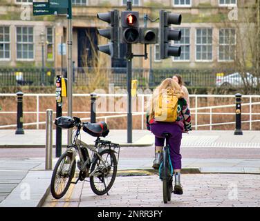 Glasgow, Scotland, UK  27th February, 2023. UK Weather: Dixon street the road to the river and the clyde walkway.   Sunny day and the spring like weather saw people take to the streets as life returned to the city centre after winter. Credit Gerard Ferry/Alamy Live News Stock Photo