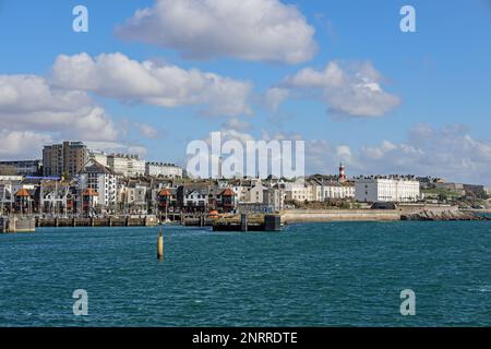 New housing at Millbay Docks in Plymouth. At West Hoe and just a short walk from the city centre. Seen across the Dock with Plymouth Hoe rising above. Stock Photo