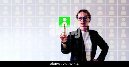 HRM manager working with virtual database of job applicants, selecting green suitable candidates for the position. Stock Photo
