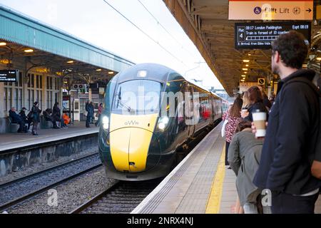 Passengers people standing on platform waiting to board approaching Great Western train to London Paddington at Cardiff railway station KATHY DEWITT Stock Photo