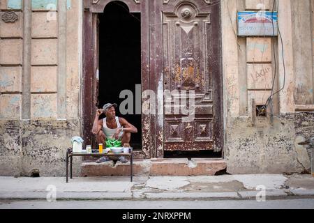 Man selling cigars and cafe,in Damas street, Habana Vieja district, La Habana, Cuba Stock Photo