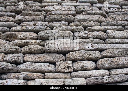 The wall is built of natural stone Stock Photo
