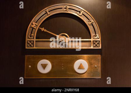 Old elevator floor indicator made of brass Stock Photo