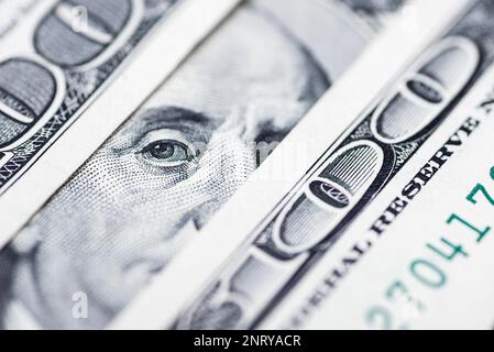 Benjamin Franklin's eyes from a hundred-dollar bill. 100 dollar bill Stock Photo