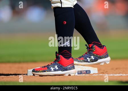 A detailed view of the baseball cleats worn by Mauricio Dubon of