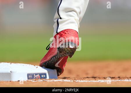 A detailed view of the baseball cleats worn by Mauricio Dubon of
