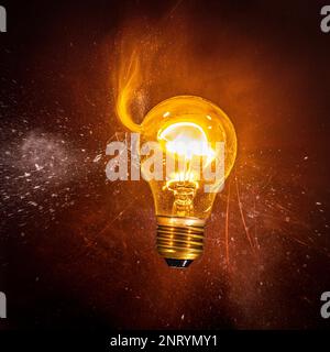 filament bulb catches fire after being struck Stock Photo