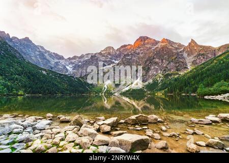 Mountain landscape with view of wonderful  sunrise of Morskie Oko (Sea Eye) lake. Amazing morning in High Tatras National Park, Poland, Europe.  Beaut Stock Photo