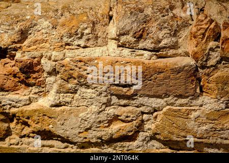 Texture of an old medieval red brick wall. Background of red brick. Turaida Castle wall, Latvia. Stock Photo