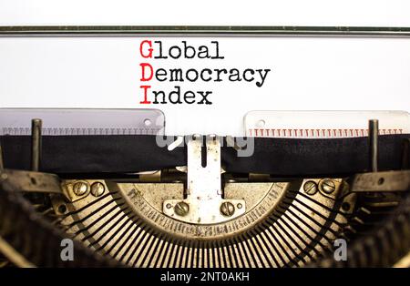 GDI global democracy index symbol. Concept words GDI global democracy index typed on retro typewriter on beautiful white paper background. Business an Stock Photo