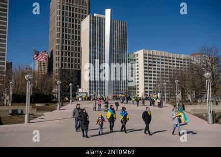 Detroit, United States. 26th Feb, 2023. Protesters depart Hart Plaza following a rally in downtown Detroit to commemorate the one year anniversary of the Russian Invasion of Ukraine. Ukrainian residents and Detroiters take to the streets in downtown Ukraine to protest Vladimir Putin's war and show their support of the Ukrainian people and army. Credit: SOPA Images Limited/Alamy Live News Stock Photo