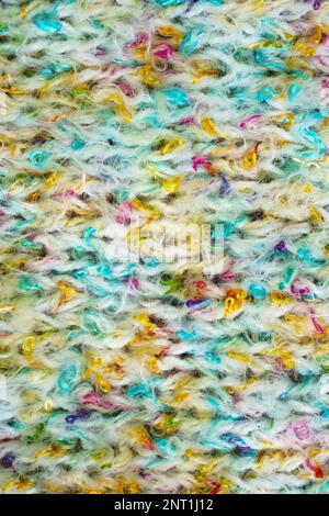Colorful light hand made crochet or knitting textile fabric texture. Close up macro background. Stock Photo