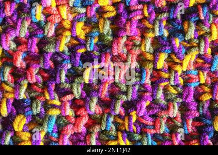 Colorful hand crochet or knitting textile fabric texture. Close up macro background. Stock Photo